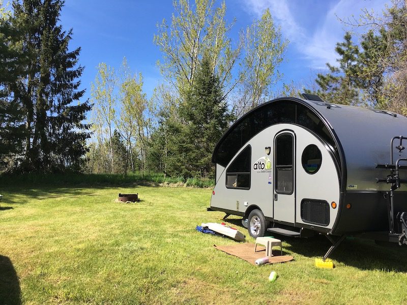 Alto 1713 Trailer set up on grass covered campsite at McRae Point Provincial Park