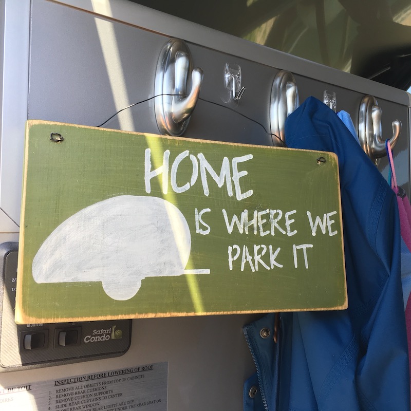 Home is where we park it sign hung up inside door of Alto 1713 trailer
