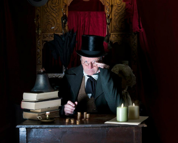 Ron Reed as Ebeneezer Scrooge in Pacific Theatre's A Christmas Carol. Photo by Andrew Smith.