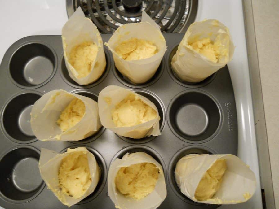 In baking Bolo de Arroz recipe, line the moulds in a muffin pan. It helps keep their shape.