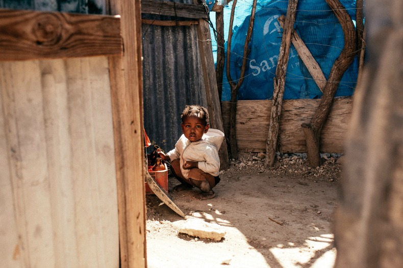 A child living in poverty, as photographed by Madi Robson.