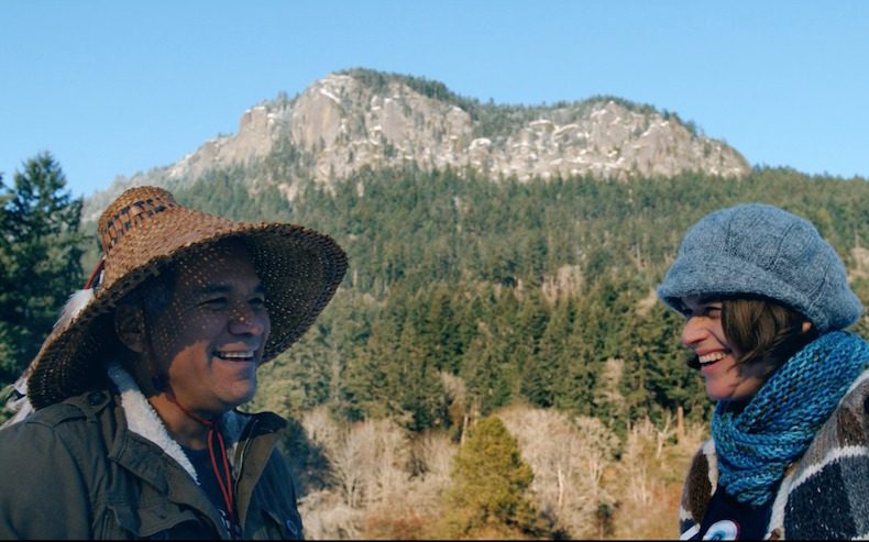 Hwiemtun and Erica Hargreave with Mount Maxwell in the background on SaltSpring Island