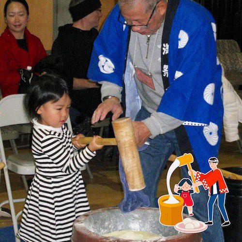 A young girl holding the wooden mallet to pound mochi at Mochitsuki Day at Nikkei Cultural Centre.