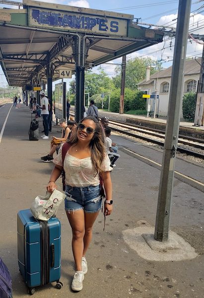 Woman with a suitcase on the platform at Etampes Train Station