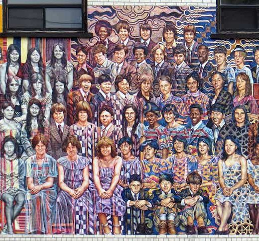 A mural in the style of a class photo, celebrating the ethnic and cultural character of Islington as it has changed over the last century.