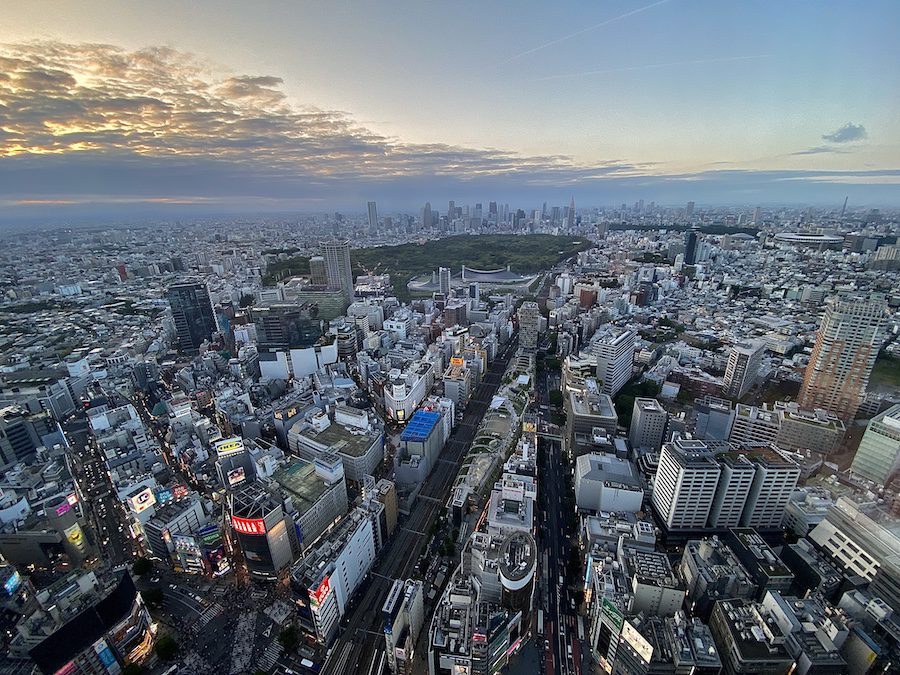Shibuya, Tokyo cityscape viewed from the top of Shibuya Sky at sunset.