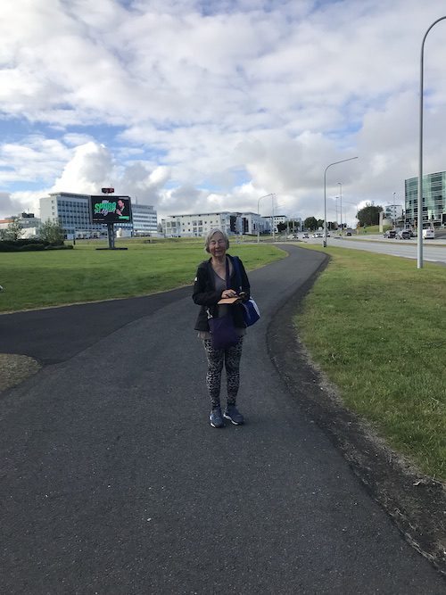 A woman walking to Downtown Reykjavik.