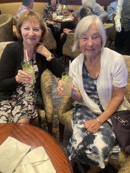 Anne and Vera dressed up for cocktails and raising a glass from the Oceania Insignia.