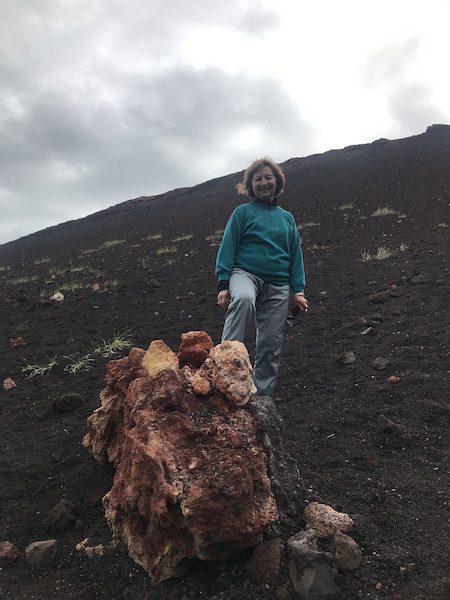 Anne in a lava field from the 1973 Eldfell volcanic eruption.