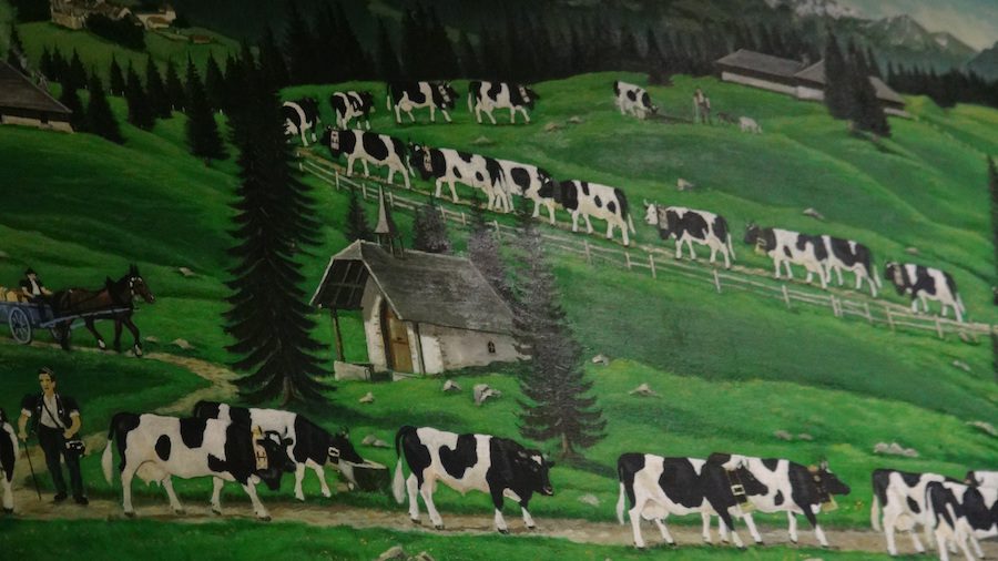 Artist depiction of Gruyere Cows heading into the alpine.