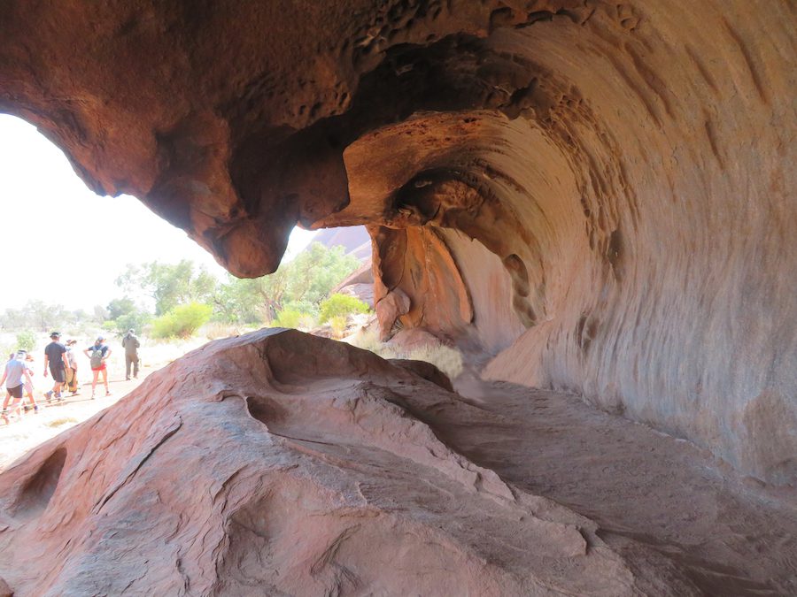 Uluru looks solid but caves and hollowed out areas create places dedicated to special purposes such as cooking or as in this case, a teaching cave for young Anangu boys. 