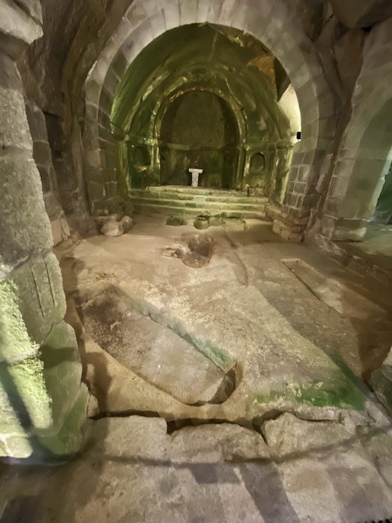 The stone floor contains the remains of graves in the interior of the 12th century church of San Pedro de Rocas