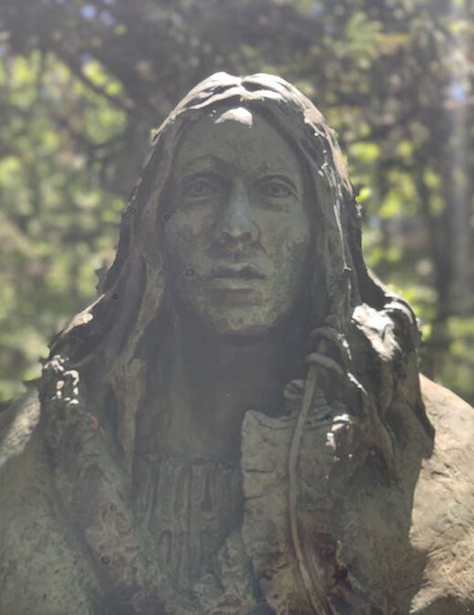 Gerry Squire's Spirit of Shanawdithit statue in the forest on the trail to the Beothuk Village at the Beothuk Interpretation Centre in Boyd's Cove, Newfoundland.