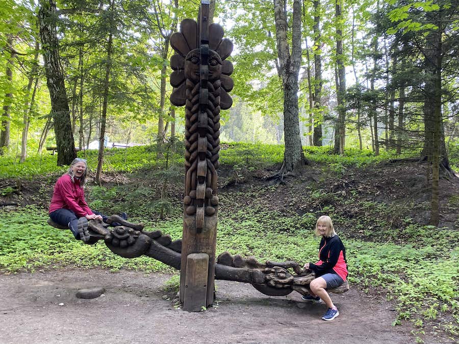 Wooden seesaw sculpture from Lithuanian folklore, on the Hill of Witches.