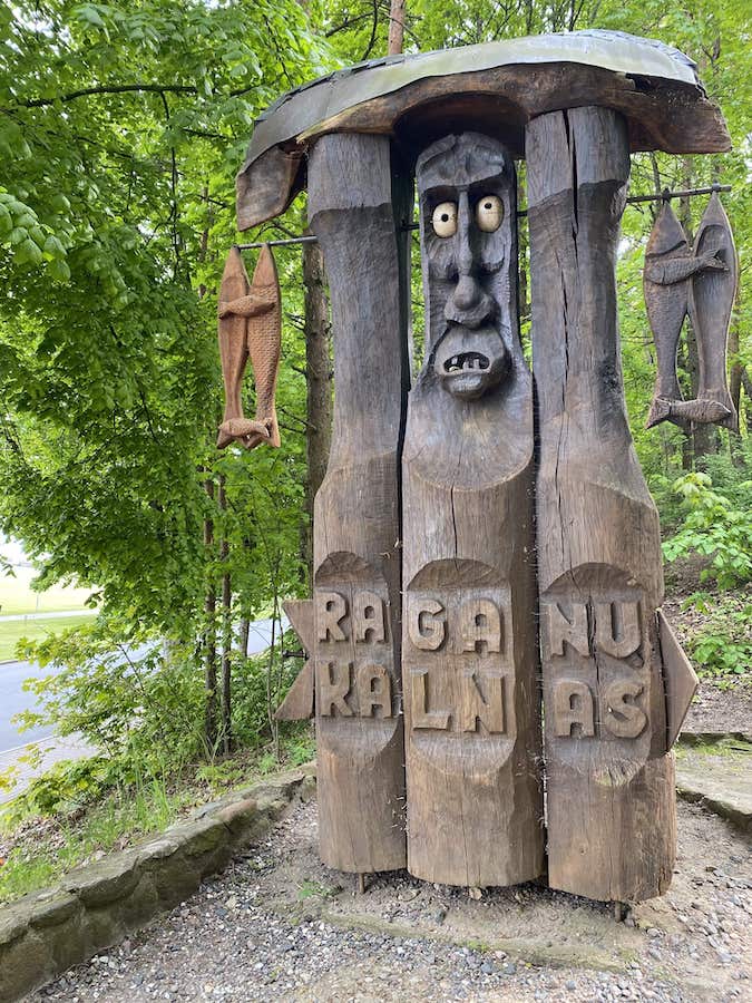 Wooden sculpture with fish hanging from, from Lithuanian folklore, on the Hill of Witches.