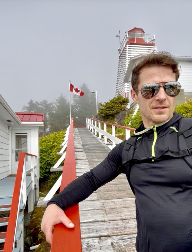 A fellow poses for a photo at Cape Beale Lighthouse.