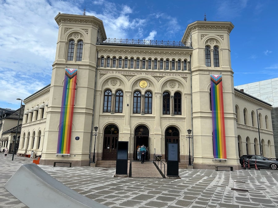 Nobel Peace Center decorated with rainbow coloured flags.