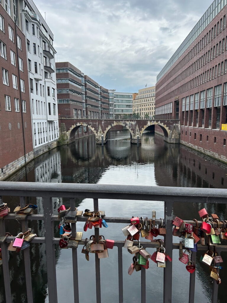 Love locks festoon the canal bridges in Hamburg, Germany.