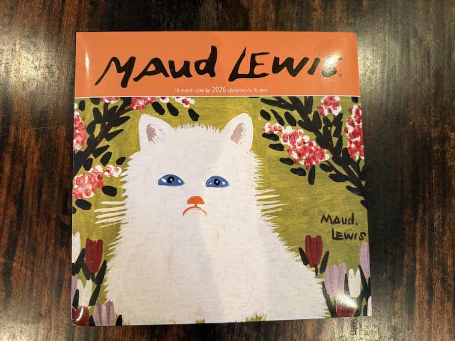 Front cover of 2026 Maud Lewis Calendar with Maud's painting of a white cat.