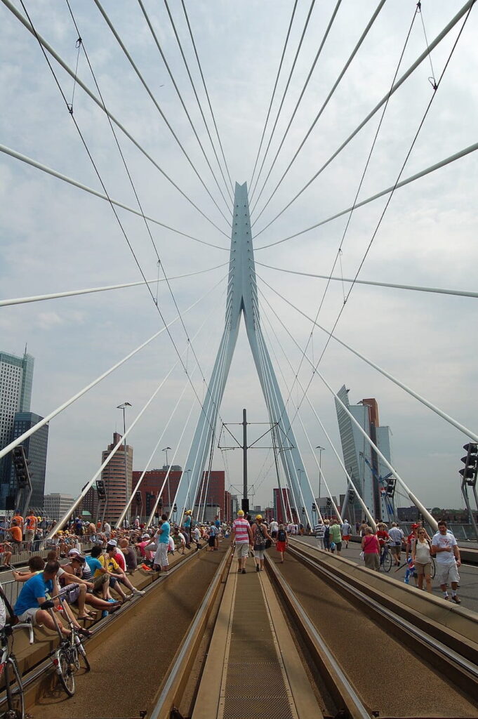 Pedestrians and cyclists enjoying a journey across Erasmusbrug in Rotterdam.
