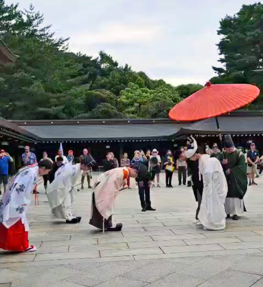 A display of mutual respect at a wedding ritual at Meiji shrine. Part of Japanese culture at shrines and temples in Japan.