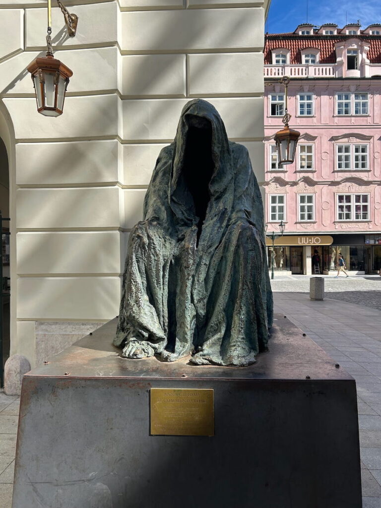 A statue of Mozart’s Don Giovanni sitting beside Estates Theatre in Prague, Czechia.