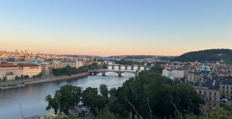 Views over the Vtlava River from Letna Park at sunset.