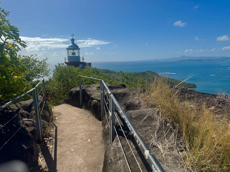 The light of the Caravelle Lighthouse peaks out as we walk around the headland in Caravelle Peninsula Nature Reserve.