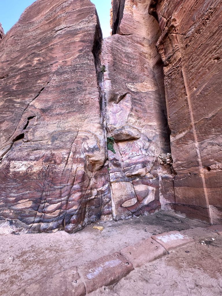 Colourful bands and wavy Liesegang rings create beautiful patterns in the desert rocks in Petra.
